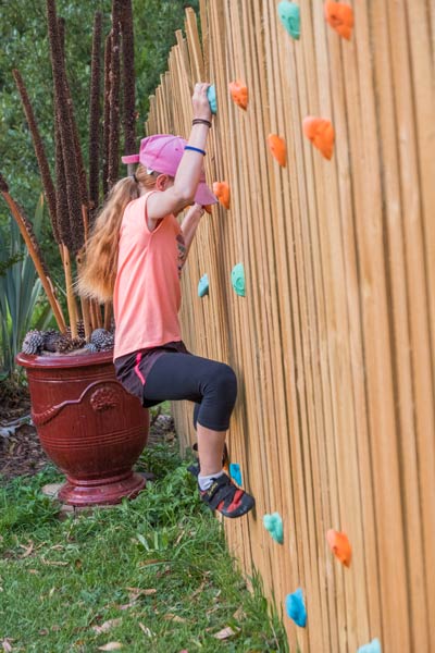 A fence can be a climbing wall with screw-on climbing holds